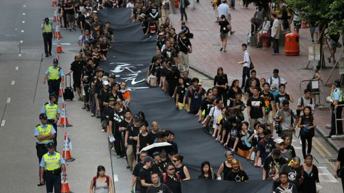 Black-clad protesters mourn as hopes crushed for Hong Kong democracy