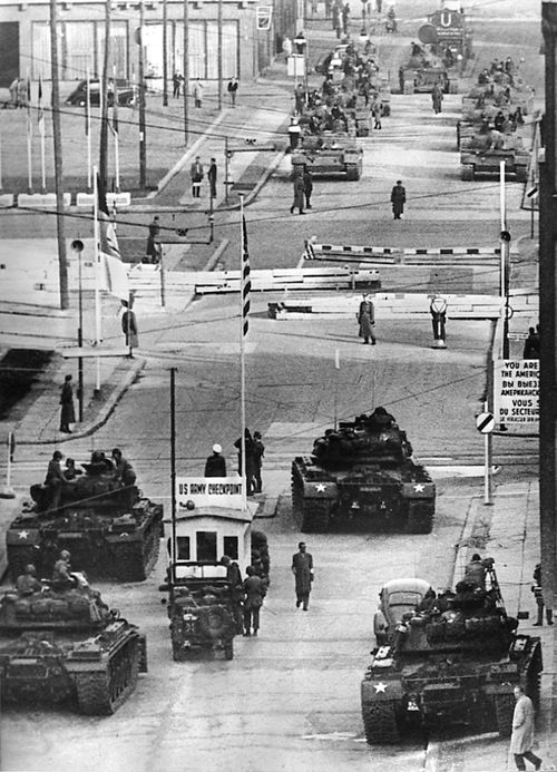U.S. Army tanks, foreground, face off against Soviet tanks across the Berlin Wall at Checkpoint Charlie on the Friedrichstrasse, in a tense standoff on Oct. 27 and 28, 1961.