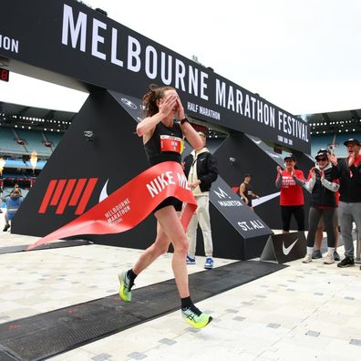 Gemma Maini crosses the finish line at the Melbourne marathon