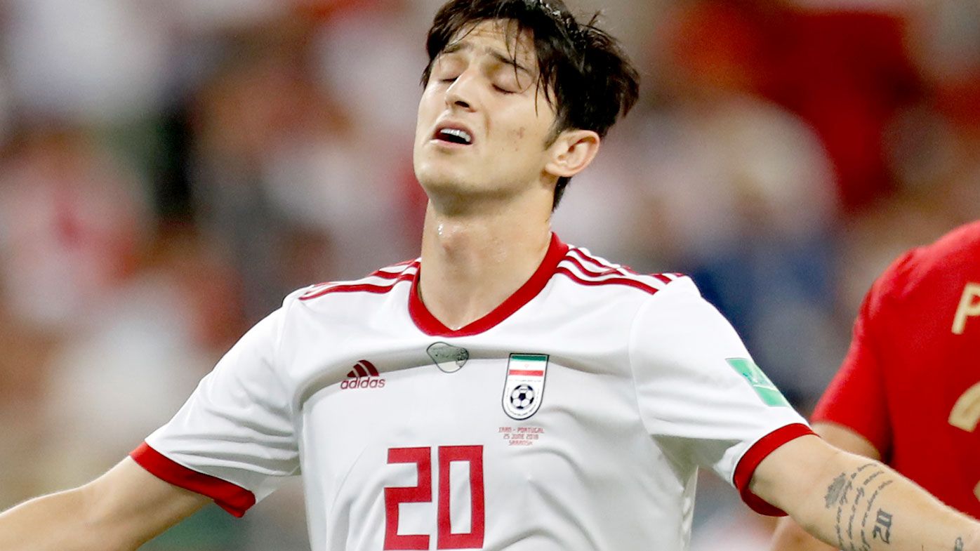 Sardar Azmoun reacts during the group B match between Iran and Portugal at the World Cup. (AAP)