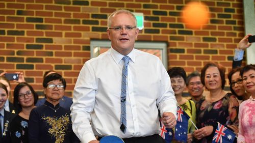 Prime Minister Scott Morrison plays table tennis at a multicultural event at Koondoola, WA.