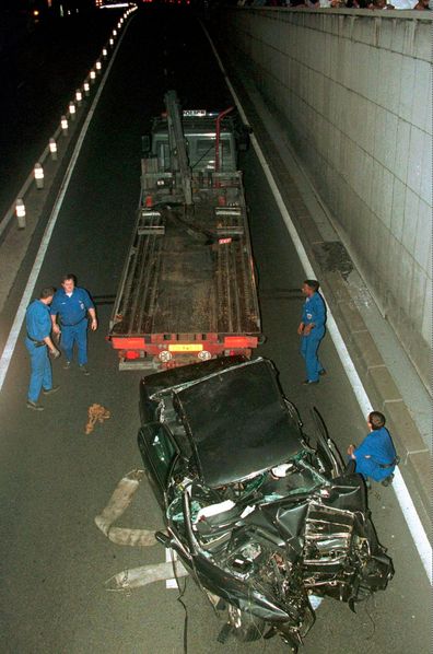 Police remove the crumpled wreck of the Mercedez-Benz which was carrying Princess Diana in Paris early August 31.