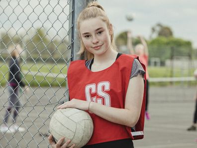 Netballer standing by the court