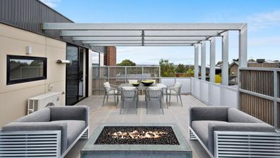 Apartment rooftop fire pit Domain listing