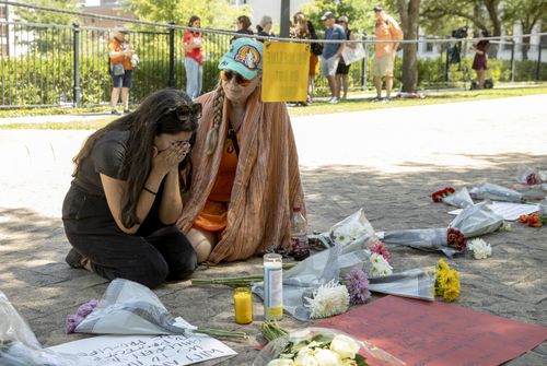 Iliana Calles cries at the Governor's Mansion, in Austin, Texas, during a protest organized by Moms Demand Action after a mass shooting at an elementary school in Uvalde, Texas. 