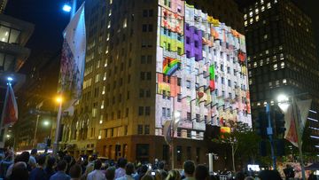 Images are projected on the Lindt Cafe building during a ceremony. (AAP)