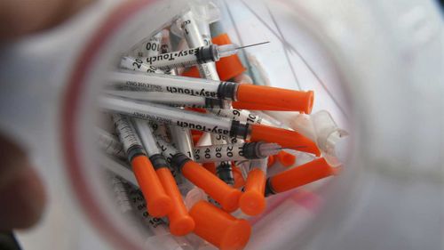 A jug of used needles in an exchange program in Camden, New Jersey.