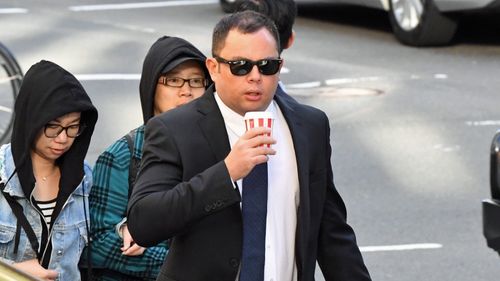 Ian Juurik arrives at the Downing Centre Courts, Sydney, Monday, April 1, 2019. Garbage truck driver Ian Juurik has pleaded not guilty to negligent driving causing death after he ran over a homeless man in Redfern in May 2018.