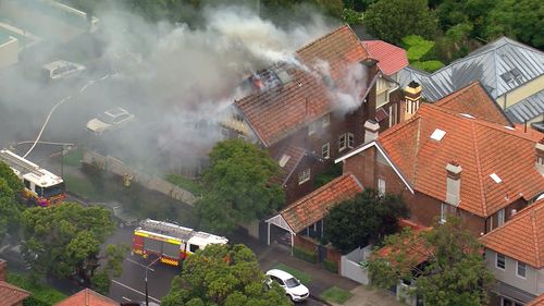 The fire tore through a two-storey home in Mosman.