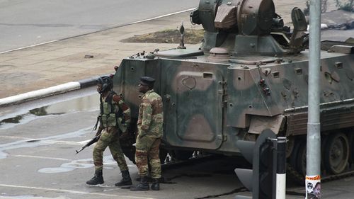 Armoured personnel carriers were seen outside the capital a day after the army commander Chiwenga threatened to "step in" to calm political tensions over the president's firing of his deputy. (AAP)