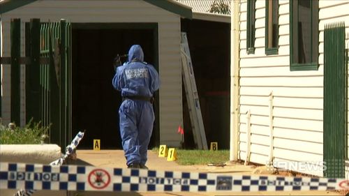 Forensic officers at a crime scene (9NEWS)