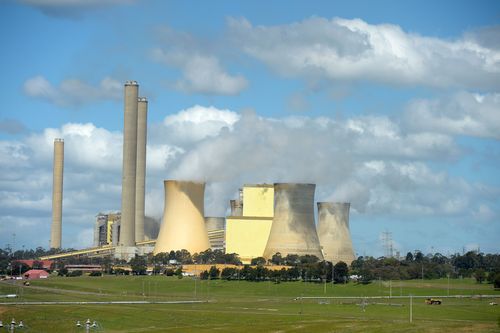 Vapor rises from cooling towers at AGL's Loy Yang Power Station in the Latrobe Valley, Victoria.