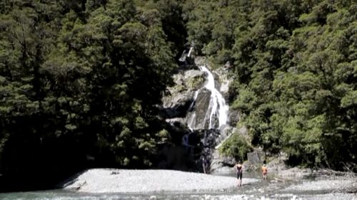 This Tuesday, Feb. 11, 2020, image made from video shows posters including a photo of British hiker Stephanie Simpson, left bottom, at Mount Aspiring National Park, New Zealand. Searchers found the body of Simpson on Friday, Feb. 14, 2020, almost a week after she went hiking in the national park. 