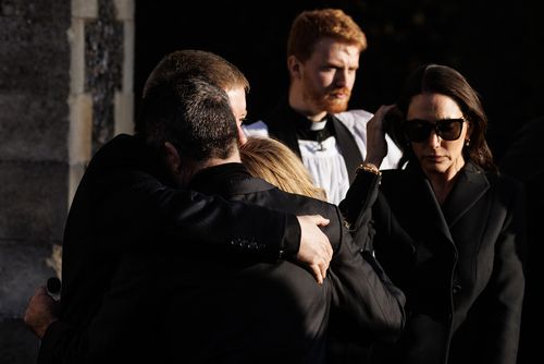 Simon Cowell comforts Liam Payne's parents, Karen and Geoff Payne