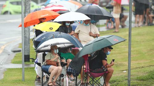 People wait in line for a COVID test at Robina Health Precinct on the Gold Coast.