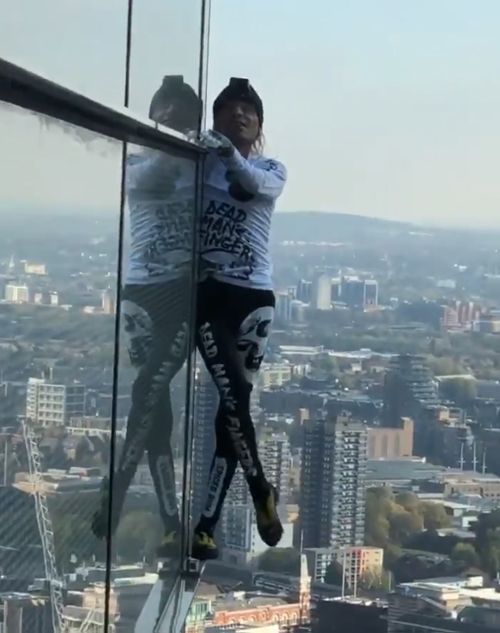 A 56-year-old man has scaled one of England's tallest buildings without the support of wires.