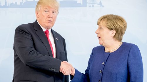 Donald Trump and Angela Merkel meet. (AAP)