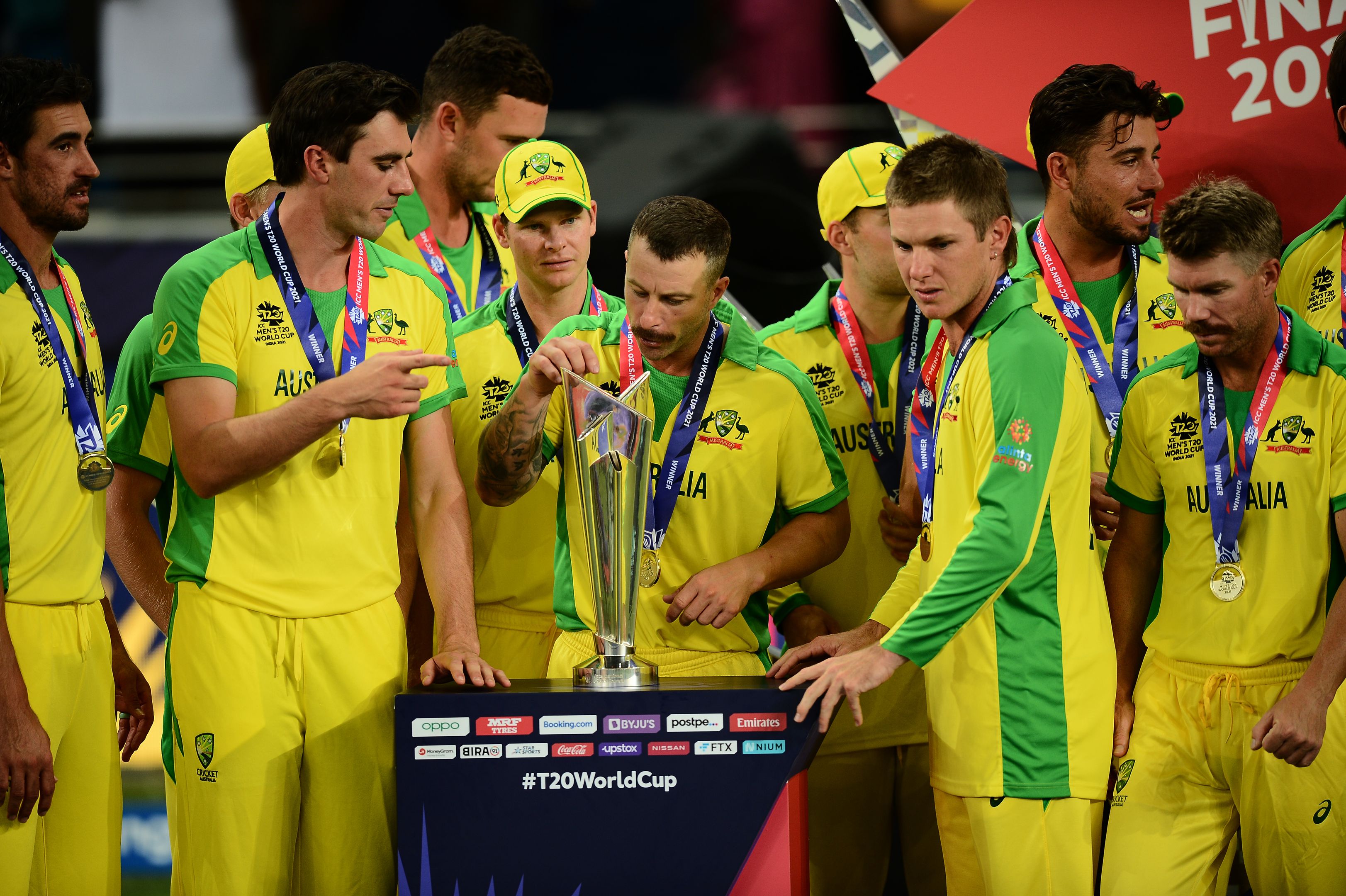 Australian players check out the trophy.