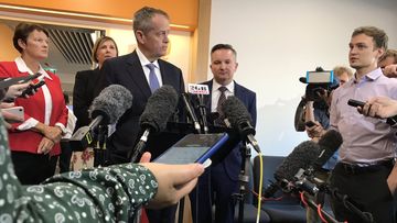 Bill Shorten answers questions from reporters in Perth.