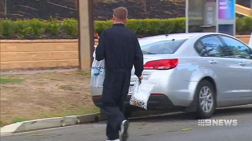 Officers swarmed the Henley Beach home last night. (9NEWS)