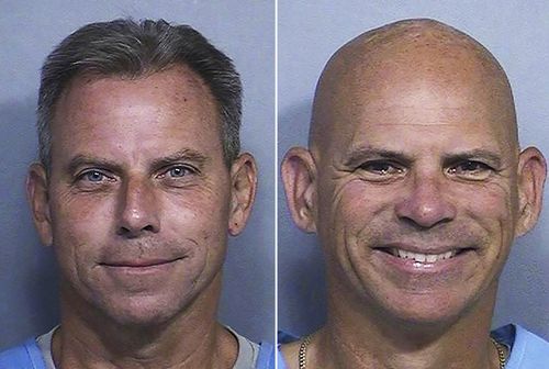 This combination of two booking photos provided by the California Department of Corrections shows Erik Menendez, left, and Lyle Menendez.