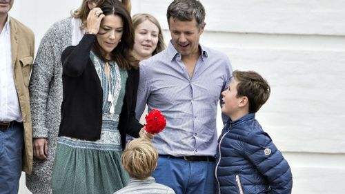 The royal family’s dogs hovered at their feet during the shoot. (AAP)