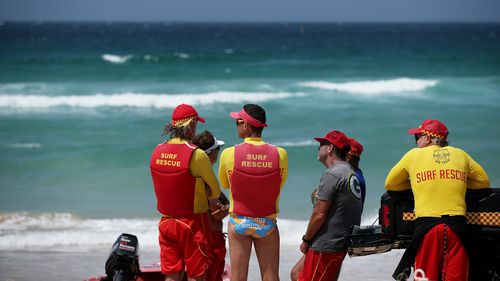  Lifesavers keep a watch on the ocean at Bondi Beach in Sydney, due to a tsunami warning.