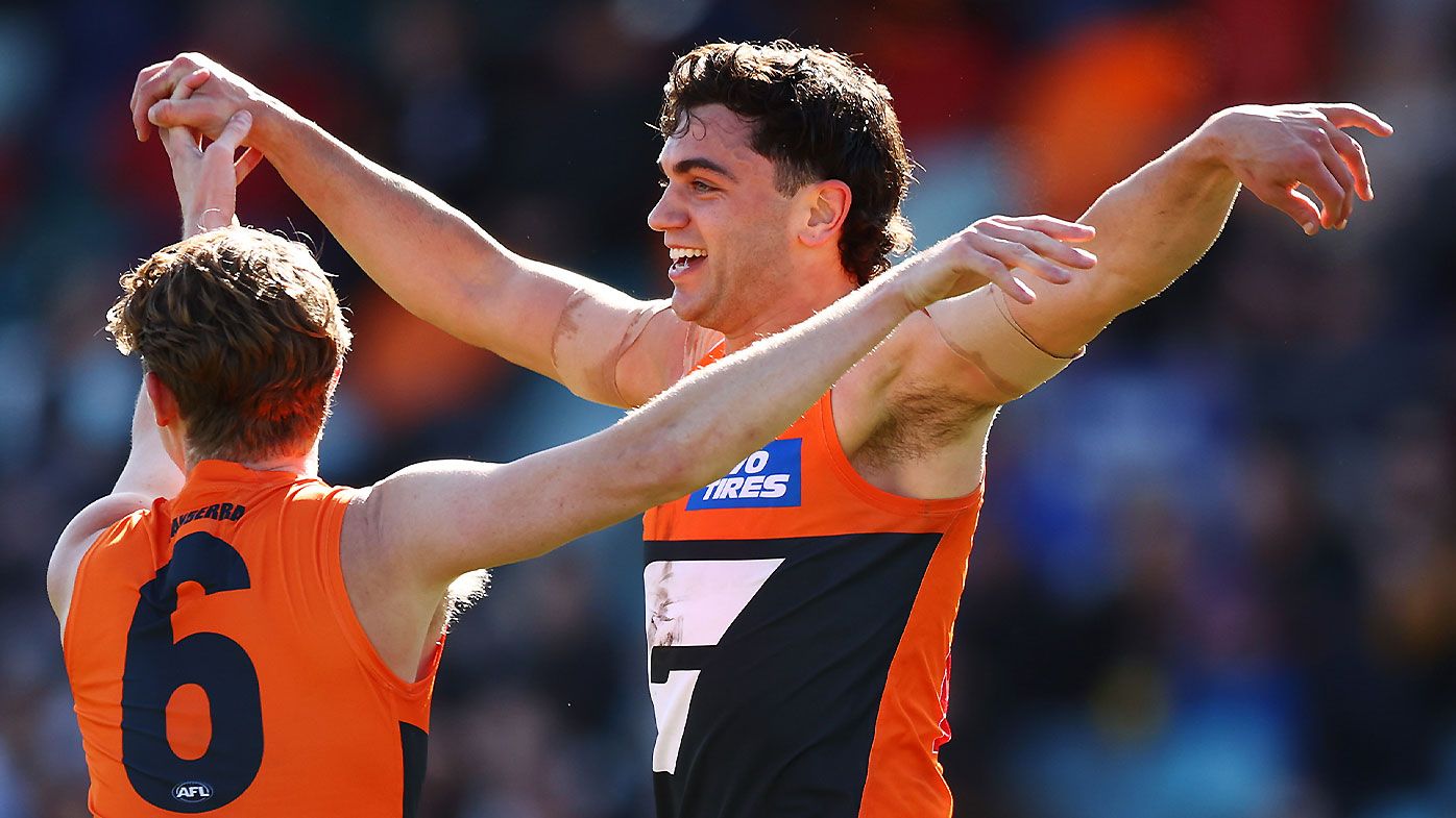 Tim Taranto celebrates a goal with Lachie Whitfield