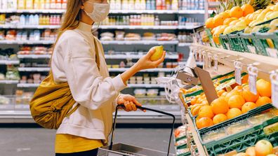 Woman in face mask at grocery store