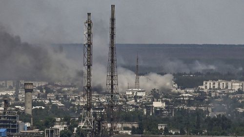 Black smoke and dirt rise from the nearby city of Severodonetsk during battle between Russian and Ukrainian troops in the eastern Ukraine region of Donbas. 