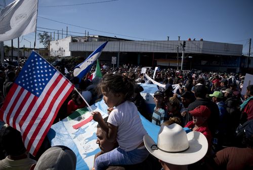 The hundreds of migrants have spent at least two weeks trekking across Mexico to try and get into the US.