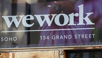 A WeWork logo at the entrance to one of their office spaces in the SoHo neighbourhood of New York. 