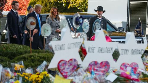 President Donald Trump (left) walks with Melania, Ivanka (centre) and son-in-law Jared Kushner, alongside Tree of Life Synagogue rabbi Jeffrey Myers, near the memorial site to the 11 victims in Pittsburgh. 