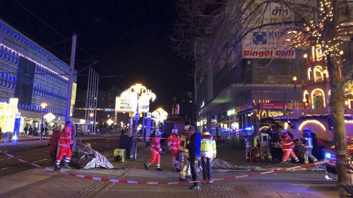 Emergency services attend an incident at the Christmas market in Magdeburg, Germany, Friday Dec. 20, 2024. (Dörthe Hein/dpa via AP)