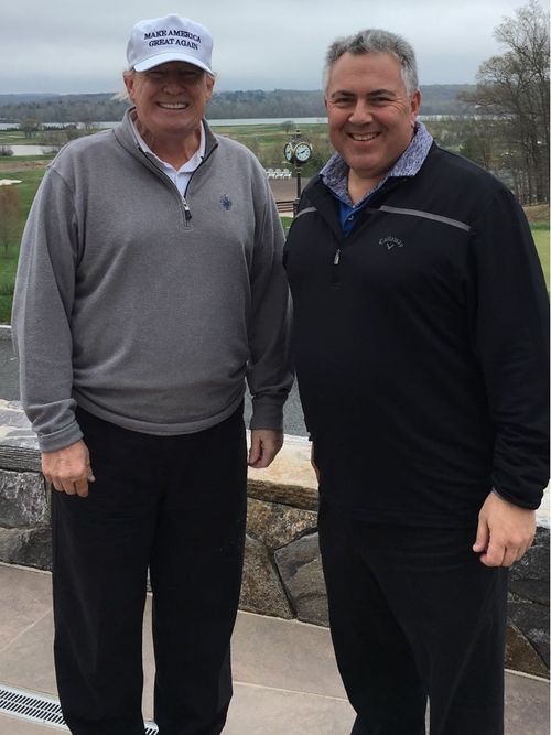 President Trump and Joe Hockey braved wind and rain to play nine rounds of golf at the Trump National in Virginia. (Supplied)