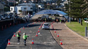 A steady trickle of cars enters the COVID-19 testing station in Bondi ahead of the weekend. 