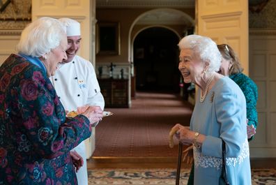 Queen Elizabeth meets Angela Wood, the women who helped create the Coronation Chicken recipe, during a reception in the Ballroom of Sandringham House,
