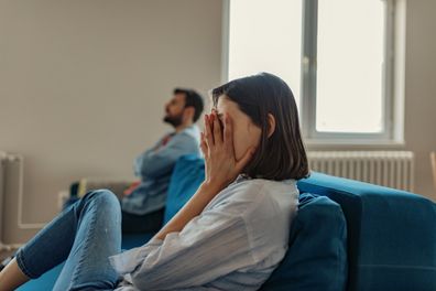 Unhappy couple in living room