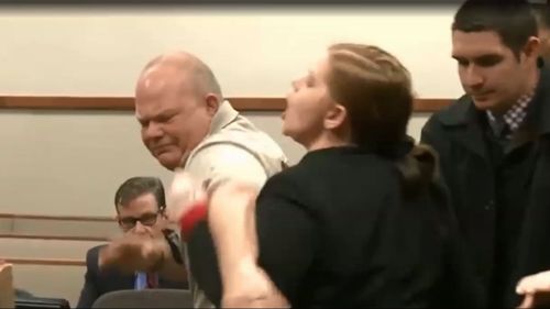 Marie Elizabeth Wren is restrained in a Kentucky court as she calls out to the man accused of killing her two sons. (WLKY)