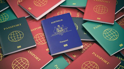 Passport of Australia on the pile of different passports. Immigration concept. Australian passport. 3d illustration