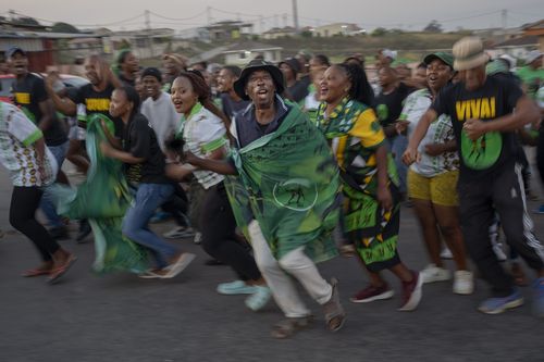 MK Party supporters celebrate in the middle of the street in Mahlbnathini village in rural KwaZulu-Natal, South Africa, on Thursday May 30, 2024.
