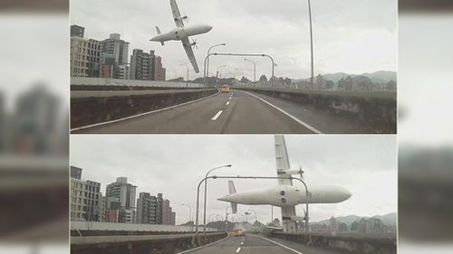 A dashcam pictures the plane flying lower over a bridge in Taipei before crashing in the river. (Supplied)