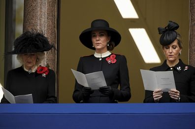 Camilla, Duchess of Cornwall, left, Kate, Duchess of Cambridge and Sophie, Countess of Wessex, right, stand on the balcony of the Foreign Office  during the Remembrance Sunday service at the Cenotaph, in Whitehall, London, Sunday Nov. 14, 2021. (Toby Melville/Pool via AP)