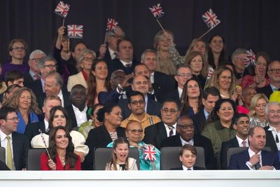 Royals wave British flags at the concert