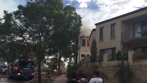 Bushfire damages home, forces evacuation of university north of Perth