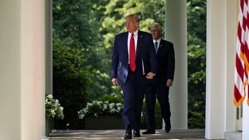 President Donald Trump and Vice President Mike Pence arrive for a news conference in the Rose Garden of the White House, Friday, June 5, 2020, in Washington