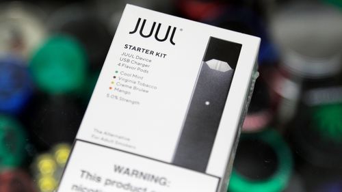 This file photo, taken in 2018, shows a Juul electronic cigarette starter kit at a smoke shop in New York.