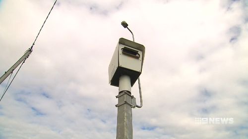 Police in Adelaide are hunting a man who tried to torch a speed camera in the city's west.