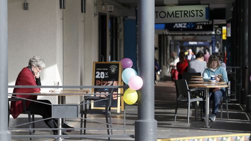 People are seen having coffee on the Parade in Norwood, Adelaide. Cafes are now allowed to serve coffee and food outside with the ease Covid-19 restrictions in Adelaide, Monday, May 11, 2020