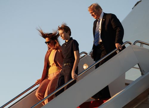 Melania, the president and their son Barron disembark from a flight on Air Force One last week. (AAP)